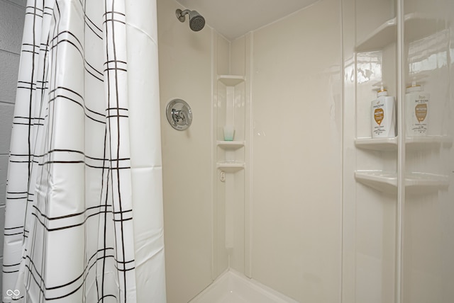 bathroom with a shower with shower curtain