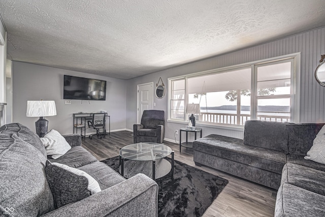 7587 Shady Side Dr, Bloomington, IN 47401 - living area with baseboards, a textured ceiling, and wood finished floors