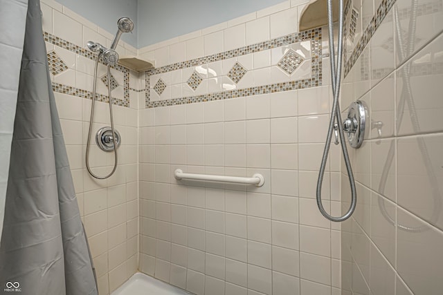 bathroom featuring a shower with curtain