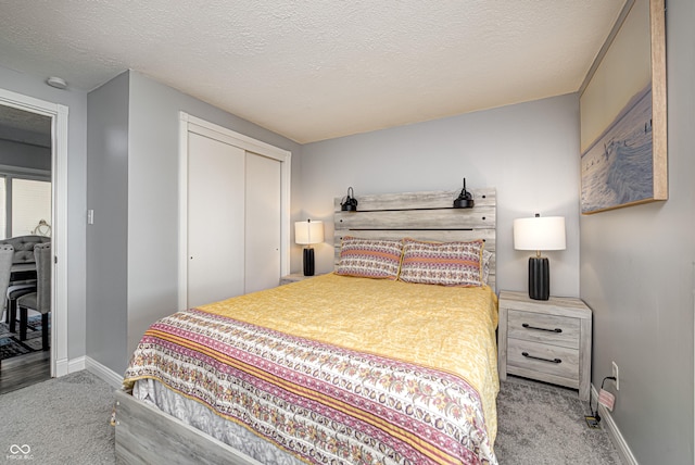 7587 Shady Side Dr, Bloomington, IN 47401 - carpeted bedroom with a closet, a textured ceiling, and baseboards