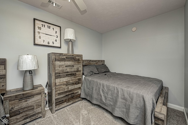 7587 Shady Side Dr, Bloomington, IN 47401 - bedroom with carpet floors, a textured ceiling, visible vents, and ceiling fan