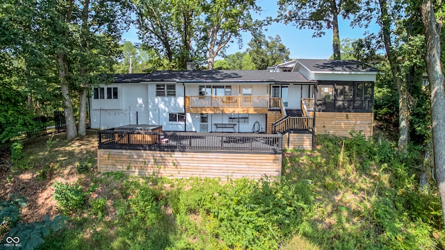 back of house with a wooden deck