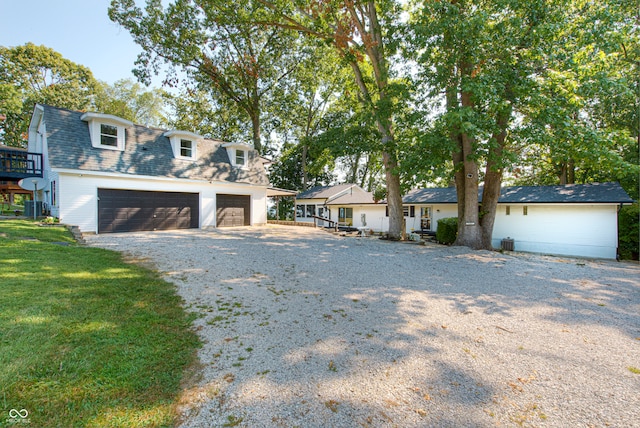 view of front facade with a front yard and a garage