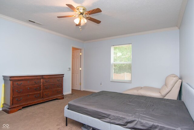 carpeted bedroom featuring crown molding, a textured ceiling, and ceiling fan