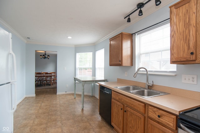 kitchen featuring ornamental molding, a healthy amount of sunlight, sink, and dishwasher