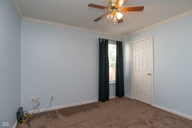 carpeted empty room with ceiling fan and ornamental molding