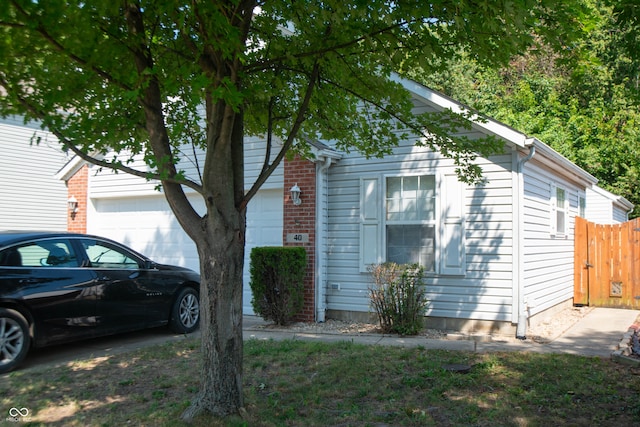 view of side of property with a garage