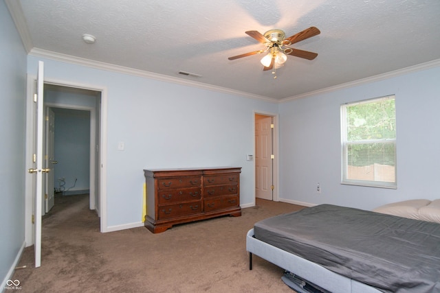 bedroom featuring a textured ceiling, light colored carpet, ceiling fan, and crown molding