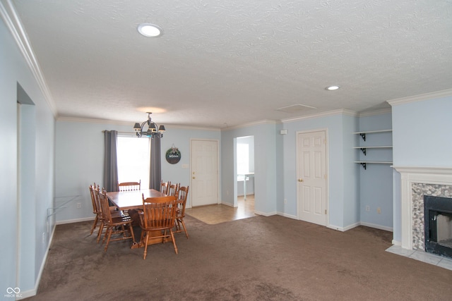 dining area featuring a tiled fireplace, a textured ceiling, and carpet flooring