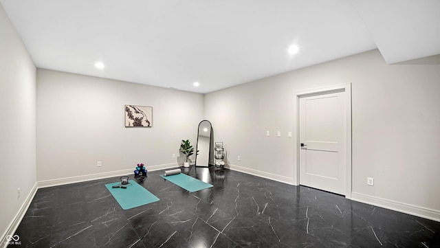 exercise room with marble finish floor, recessed lighting, and baseboards