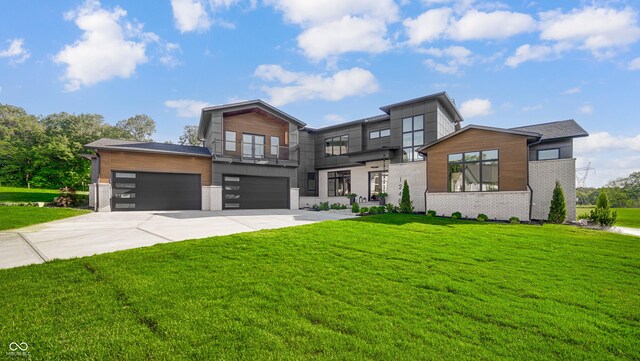 contemporary house with a balcony, a garage, and a front lawn