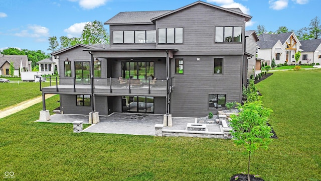 rear view of property with a yard, a residential view, and a patio