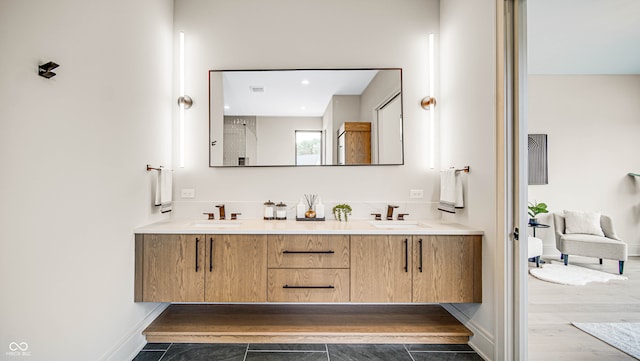 bathroom featuring vanity and hardwood / wood-style floors