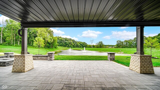 view of patio featuring a water view