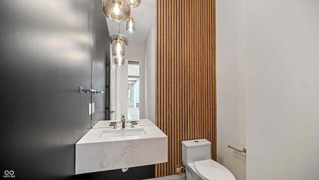 bathroom featuring a sink and toilet