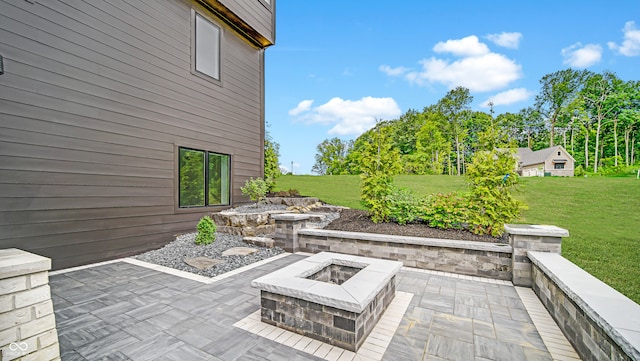 view of patio featuring an outdoor fire pit