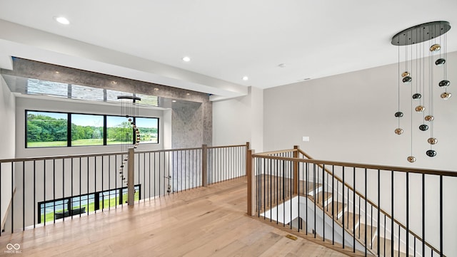 hallway with recessed lighting and wood finished floors