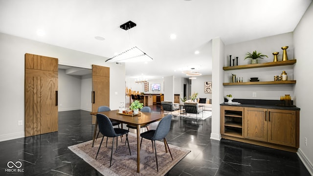 dining room featuring recessed lighting, marble finish floor, and baseboards