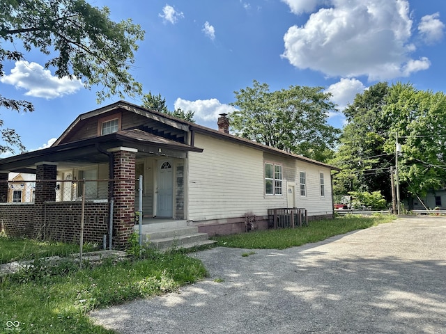 2716 E New York St, Indianapolis, IN 46201 - view of front of house featuring a chimney