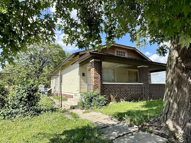 2716 E New York St, Indianapolis, IN 46201 - view of front of house with brick siding and a porch