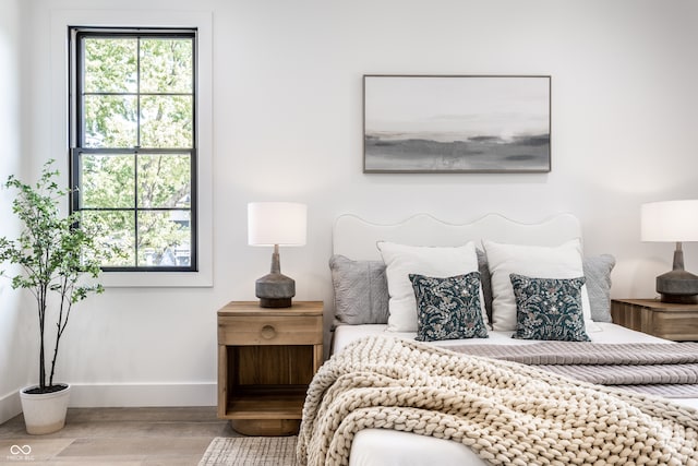 bedroom with hardwood / wood-style floors