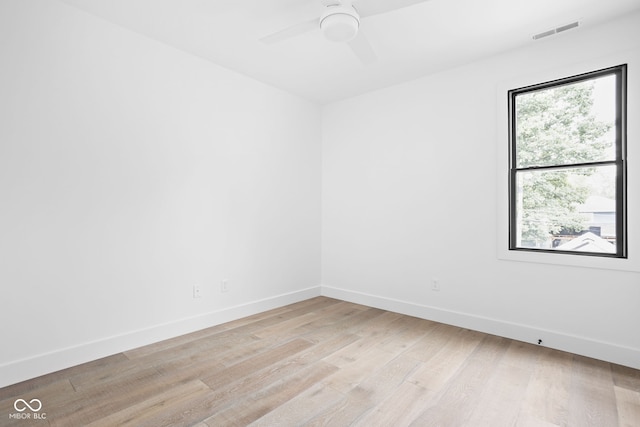 empty room featuring ceiling fan and light wood-type flooring