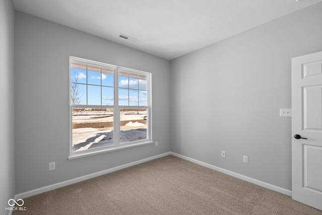 empty room featuring carpet flooring