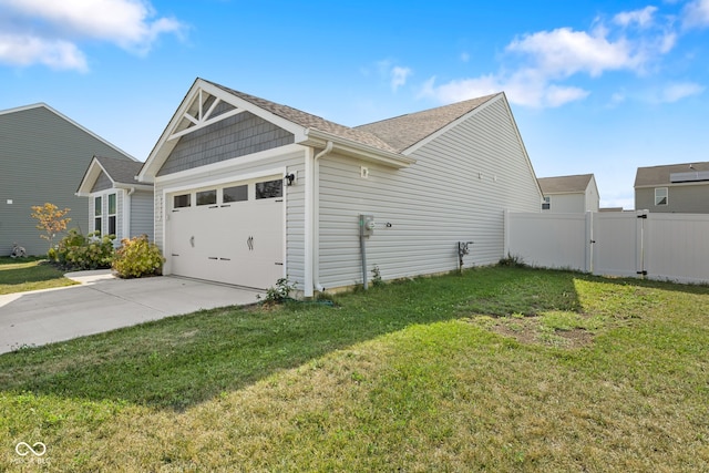 view of home's exterior featuring a yard and a garage