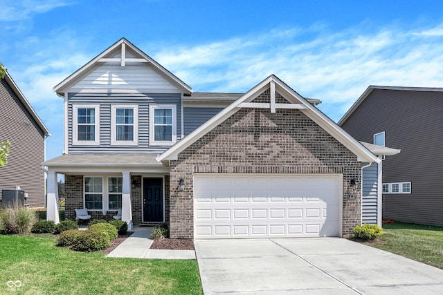 front facade featuring a front yard, a garage, and central AC unit