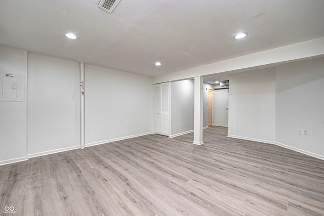 basement featuring light hardwood / wood-style flooring