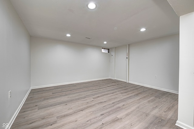 basement featuring light hardwood / wood-style flooring