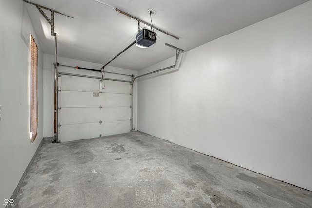 garage featuring a garage door opener