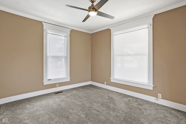 carpeted empty room featuring crown molding and ceiling fan