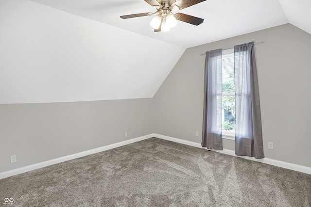 bonus room with vaulted ceiling, carpet floors, and ceiling fan