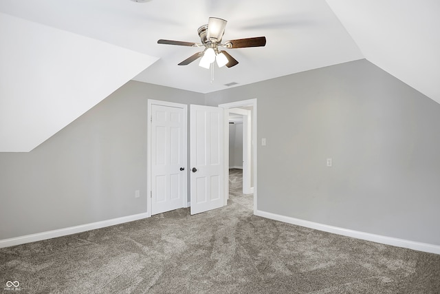 additional living space with ceiling fan, carpet floors, and vaulted ceiling