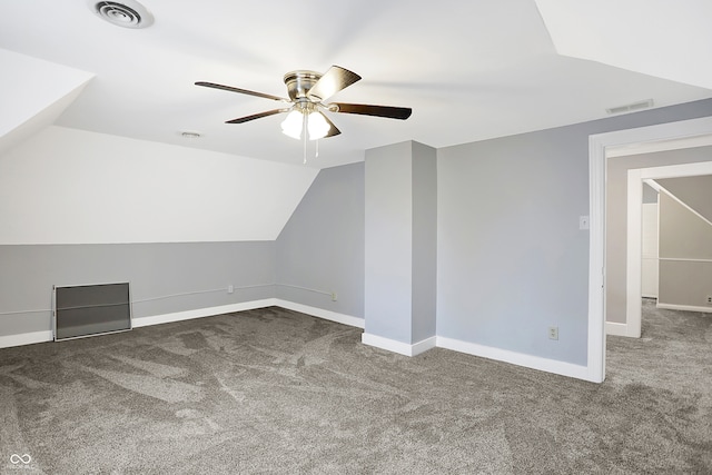 additional living space featuring lofted ceiling, ceiling fan, and carpet flooring