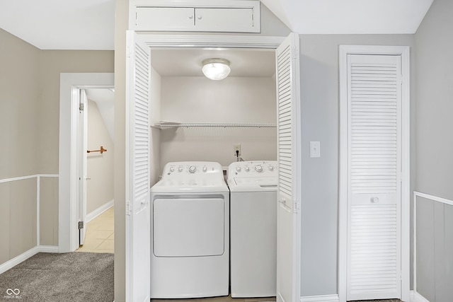 washroom featuring light carpet and washer and clothes dryer