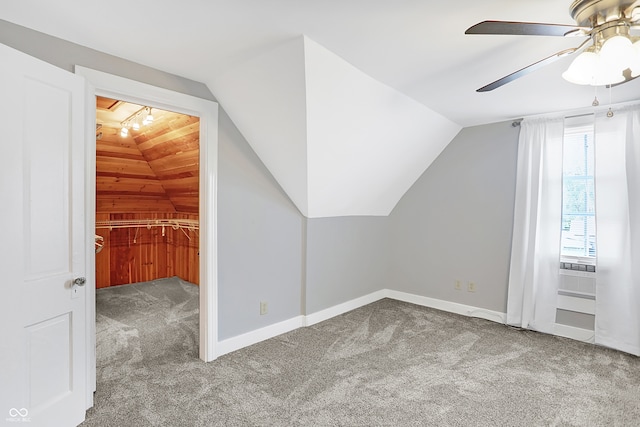 additional living space featuring wooden ceiling, lofted ceiling, ceiling fan, and carpet floors