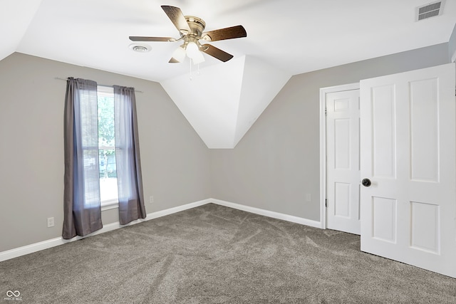 bonus room with lofted ceiling, ceiling fan, and carpet floors