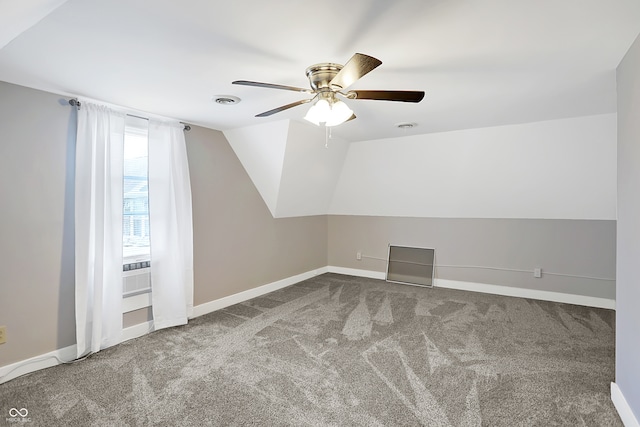 additional living space with lofted ceiling, ceiling fan, and carpet floors