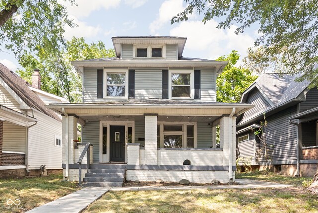 view of front of property featuring covered porch