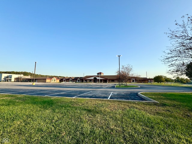 view of sport court featuring a yard