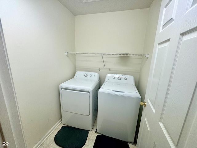 laundry room with separate washer and dryer