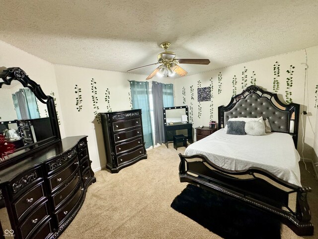 carpeted bedroom featuring a textured ceiling and ceiling fan