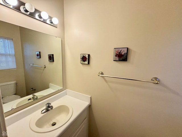 bathroom with vanity and toilet