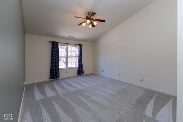 unfurnished room with a ceiling fan, baseboards, carpet floors, visible vents, and vaulted ceiling