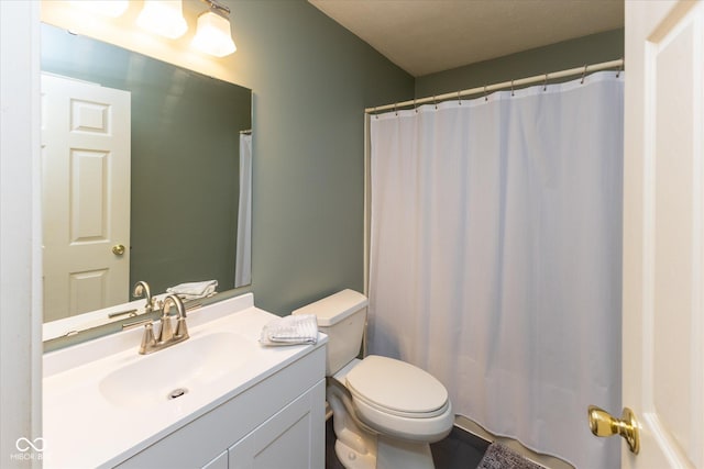 full bathroom with toilet and vanity