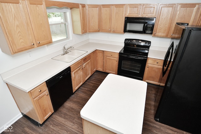 kitchen with black appliances, sink, dark wood-type flooring, and light brown cabinets