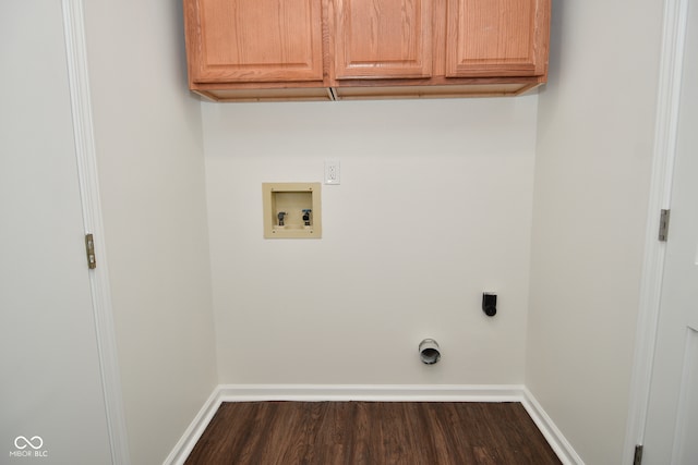 laundry area featuring cabinets, electric dryer hookup, hookup for a washing machine, and dark wood-type flooring