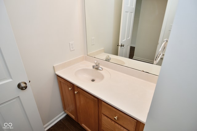 bathroom with vanity and hardwood / wood-style floors